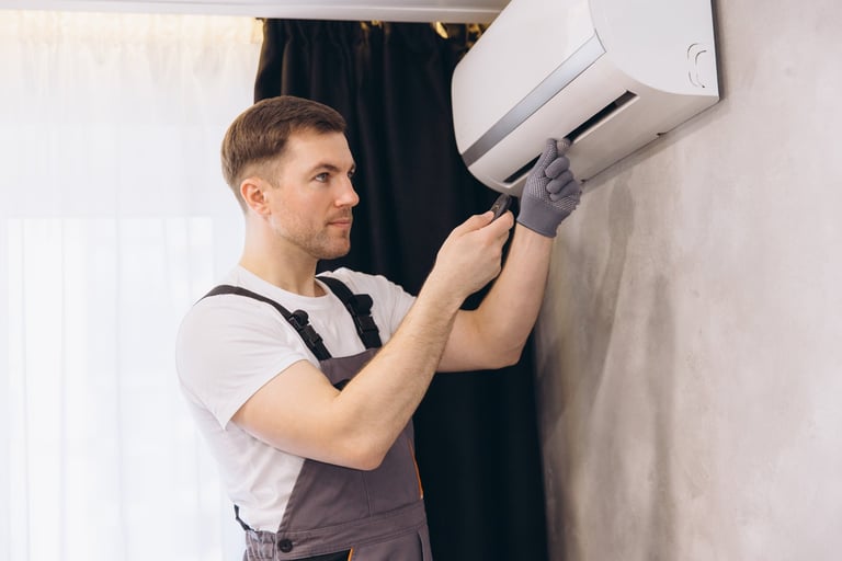 Plumber repairing an air conditioning unit
