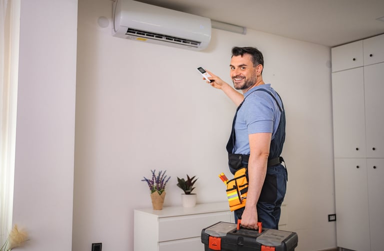 Technician installing an air conditioner