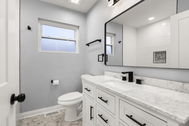 Modern white bathroom with marble countertop
